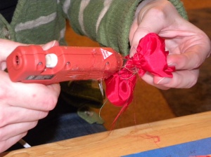 Rolling and hot glueing roses